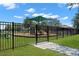 Gated playground entrance with posted rules at 15571 Stone House Dr, Brooksville, FL 34604
