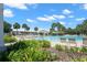 Community pool with lounge chairs and gazebo at 15571 Stone House Dr, Brooksville, FL 34604