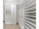 Spacious walk-in closet with ample shelving and hanging space at 15571 Stone House Dr, Brooksville, FL 34604
