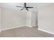 Bright bedroom with ceiling fan and closet at 17841 Althea Blue Pl, Lutz, FL 33558