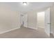 Well-lit bedroom with carpet flooring and closet at 17841 Althea Blue Pl, Lutz, FL 33558