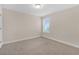 Simple bedroom with neutral walls and carpet at 17841 Althea Blue Pl, Lutz, FL 33558