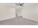 Bright bedroom with neutral walls and ceiling fan at 17841 Althea Blue Pl, Lutz, FL 33558