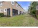 Well-maintained exterior with a screened patio and neatly landscaped yard at 17841 Althea Blue Pl, Lutz, FL 33558