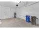 Spacious garage with ample storage space and room for two cars at 17841 Althea Blue Pl, Lutz, FL 33558