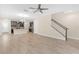 Living room, kitchen and staircase view at 17841 Althea Blue Pl, Lutz, FL 33558