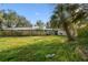 Backyard features a fence and grassy area at 1802 Mcgee Rd, Plant City, FL 33565