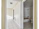 View into bathroom and bedroom featuring tile floors and a shower at 1802 Mcgee Rd, Plant City, FL 33565