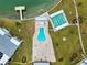 Aerial view of community pool, shuffleboard, and waterfront access at 1868 Shore S Dr # 209, South Pasadena, FL 33707