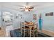 Bright dining area with wood table and seating for four at 1868 Shore S Dr # 209, South Pasadena, FL 33707