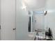 Inviting entryway with a small table and view into kitchen at 1868 Shore S Dr # 209, South Pasadena, FL 33707