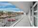 Exterior hallway offering views of parking and surrounding buildings at 1868 Shore S Dr # 209, South Pasadena, FL 33707