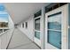 View down a condo hallway, showing various unit doors at 1868 Shore S Dr # 209, South Pasadena, FL 33707