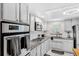 Updated kitchen featuring granite countertops and stainless steel appliances at 1868 Shore S Dr # 209, South Pasadena, FL 33707