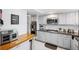 Modern kitchen with butcher block island and stainless steel appliances at 1868 Shore S Dr # 209, South Pasadena, FL 33707