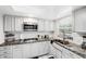 Modern kitchen featuring granite countertops and stainless steel appliances at 1868 Shore S Dr # 209, South Pasadena, FL 33707
