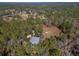 Aerial view showing home and surrounding landscape at 19256 Hidden Oaks Dr, Brooksville, FL 34604