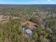 Aerial view of home nestled in a wooded area at 19256 Hidden Oaks Dr, Brooksville, FL 34604