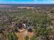 Aerial view of house and pool in a wooded area at 19256 Hidden Oaks Dr, Brooksville, FL 34604