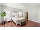 Main bedroom with hardwood floors and private bathroom access at 19256 Hidden Oaks Dr, Brooksville, FL 34604