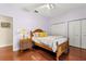 Guest bedroom with hardwood floors and built-in closet at 19256 Hidden Oaks Dr, Brooksville, FL 34604