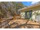 Wooden deck with two rocking chairs and access to the house at 19256 Hidden Oaks Dr, Brooksville, FL 34604
