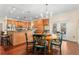 Bright dining area with a round table and chairs near kitchen at 19256 Hidden Oaks Dr, Brooksville, FL 34604