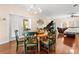 Kitchen dining area with round wooden table and green chairs at 19256 Hidden Oaks Dr, Brooksville, FL 34604