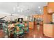 Open dining area with kitchen views and a round wooden table at 19256 Hidden Oaks Dr, Brooksville, FL 34604