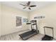 Dedicated home gym with treadmill and additional exercise equipment at 19256 Hidden Oaks Dr, Brooksville, FL 34604