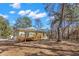 House exterior showcasing a wooden deck and backyard at 19256 Hidden Oaks Dr, Brooksville, FL 34604