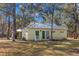 Guest house with metal roof and green doors at 19256 Hidden Oaks Dr, Brooksville, FL 34604