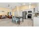 Open concept kitchen and living area with stainless steel appliances at 19256 Hidden Oaks Dr, Brooksville, FL 34604
