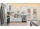Updated kitchen with stainless steel appliances and granite countertops at 19256 Hidden Oaks Dr, Brooksville, FL 34604