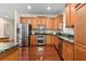 Modern kitchen with stainless steel appliances and granite countertops at 19256 Hidden Oaks Dr, Brooksville, FL 34604