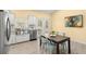 Modern kitchen with stainless steel sink and French doors to outside at 19256 Hidden Oaks Dr, Brooksville, FL 34604