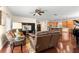 Open living room with hardwood floors and leather recliners at 19256 Hidden Oaks Dr, Brooksville, FL 34604