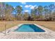 Relaxing rectangular pool with a stone deck at 19256 Hidden Oaks Dr, Brooksville, FL 34604