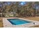 Refreshing rectangular pool with a stone deck at 19256 Hidden Oaks Dr, Brooksville, FL 34604