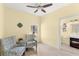 Peaceful sitting area with two armchairs and a small side table at 19256 Hidden Oaks Dr, Brooksville, FL 34604