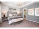 Main bedroom with large windows and plush carpet at 1988 Longliner Loop, Wesley Chapel, FL 33543