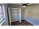 Spacious bedroom with a large closet and wood-look floors at 20 Cypress Dr, Palm Harbor, FL 34684