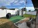 Backyard with shed, grill, and artificial turf at 2152 Arcadia Rd, Holiday, FL 34690