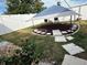 Relaxing backyard with covered patio and stone pathway at 2152 Arcadia Rd, Holiday, FL 34690