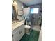 Updated bathroom with walk-in shower and modern vanity at 2152 Arcadia Rd, Holiday, FL 34690