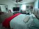 Guest bedroom with king-size bed, dresser, and ceiling fan at 2152 Arcadia Rd, Holiday, FL 34690