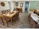 Bright dining area with wood table and six chairs at 2152 Arcadia Rd, Holiday, FL 34690