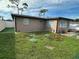 House exterior with green lawn and white fence at 2152 Arcadia Rd, Holiday, FL 34690