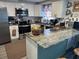 Updated kitchen, granite countertops, and breakfast bar at 2152 Arcadia Rd, Holiday, FL 34690