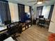 Home office featuring two workstations and a large TV at 2152 Arcadia Rd, Holiday, FL 34690